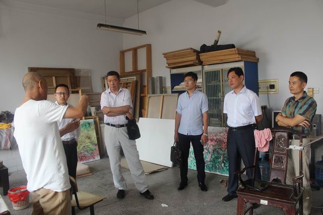 山东省美术馆副馆长、著名画家王建国一行应邀来伟德victor1946参观交流